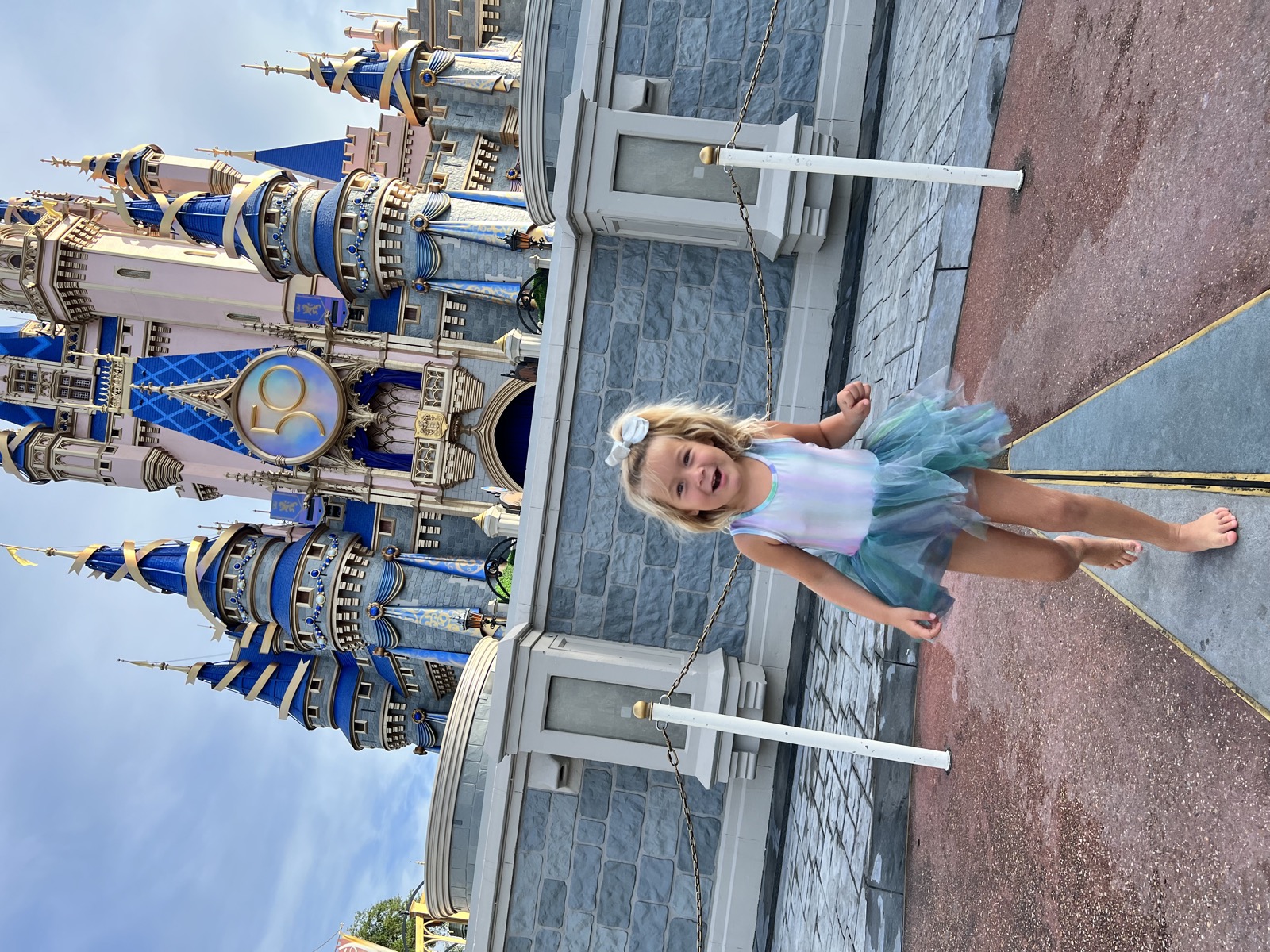 Gisele at Disney World, age 5, in a yellow ballgown.