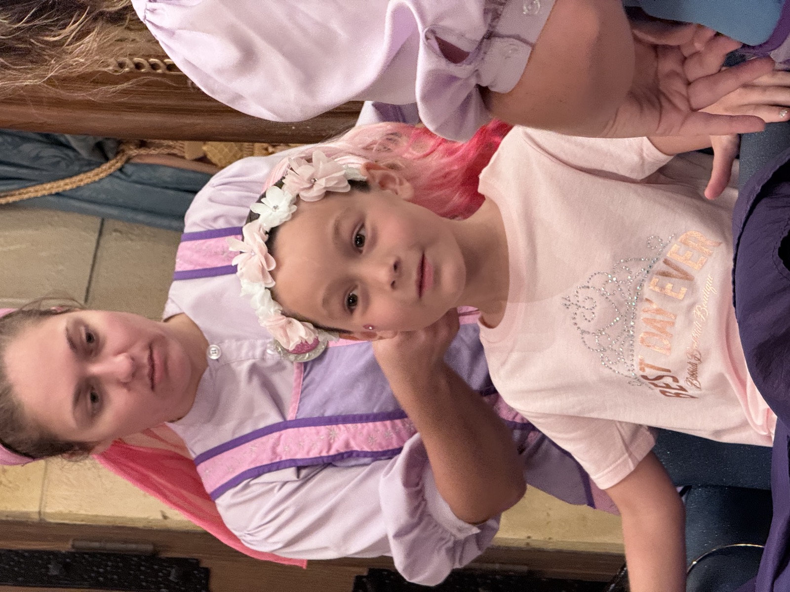 Five girls in coordinating princess dresses at a backyard birthday party.